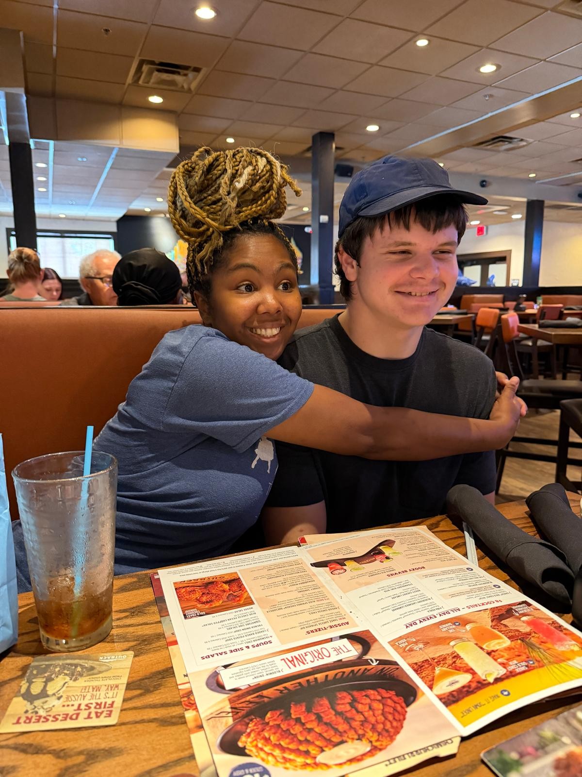 Kimberly's daughter sharing a hug with a friend
